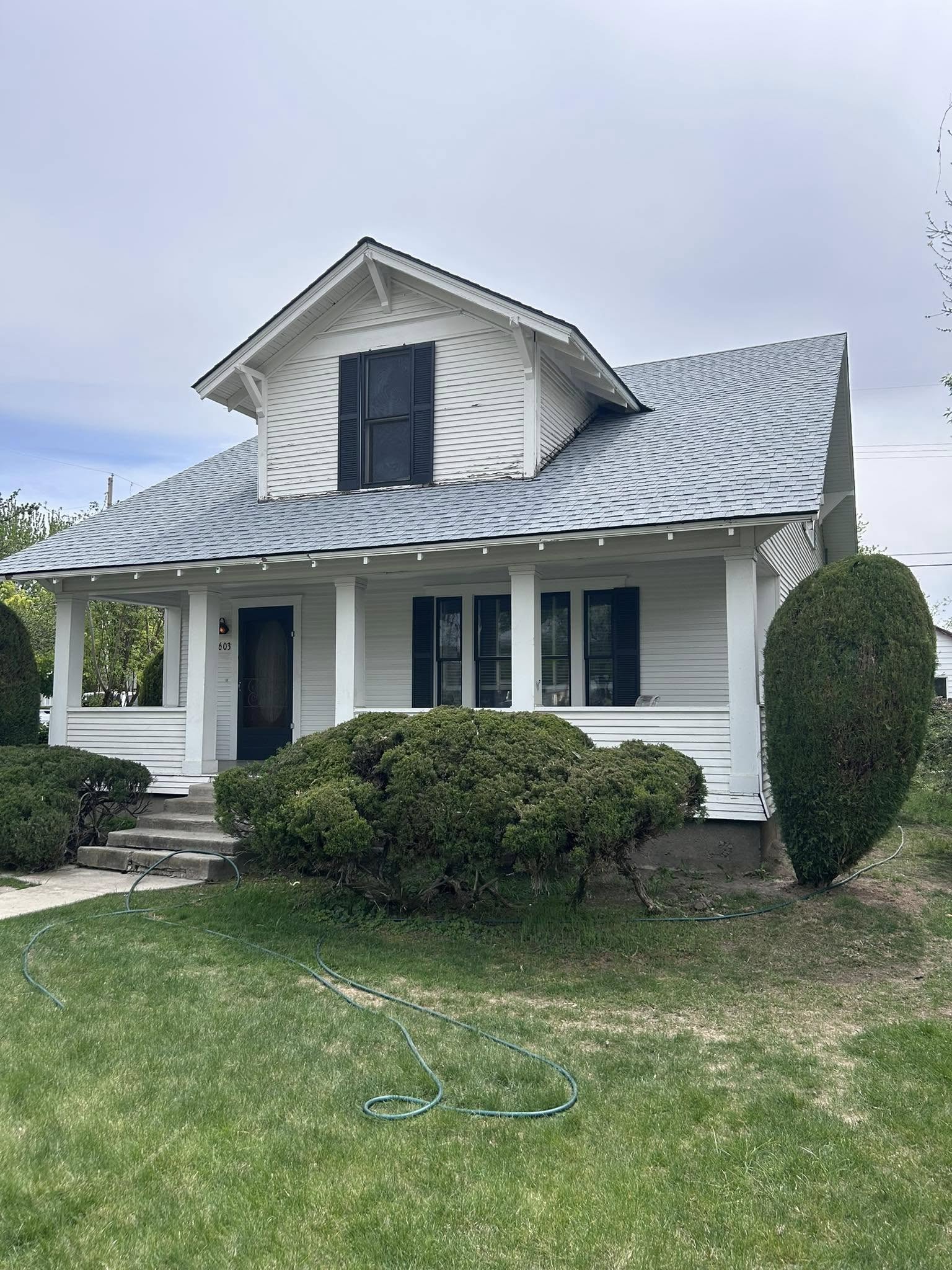front view of a home with a light colored roof