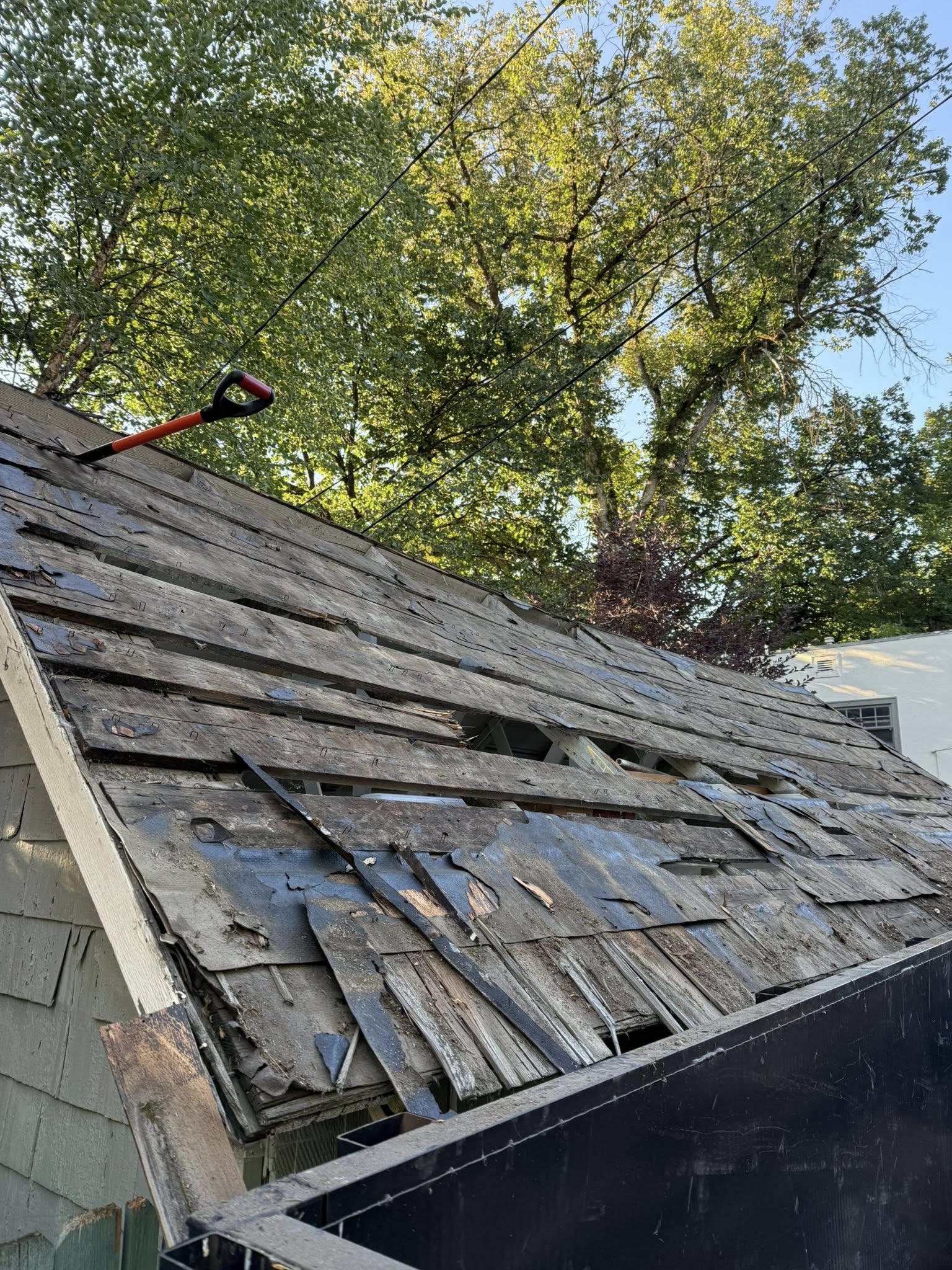 closeup of severely damaged roofing