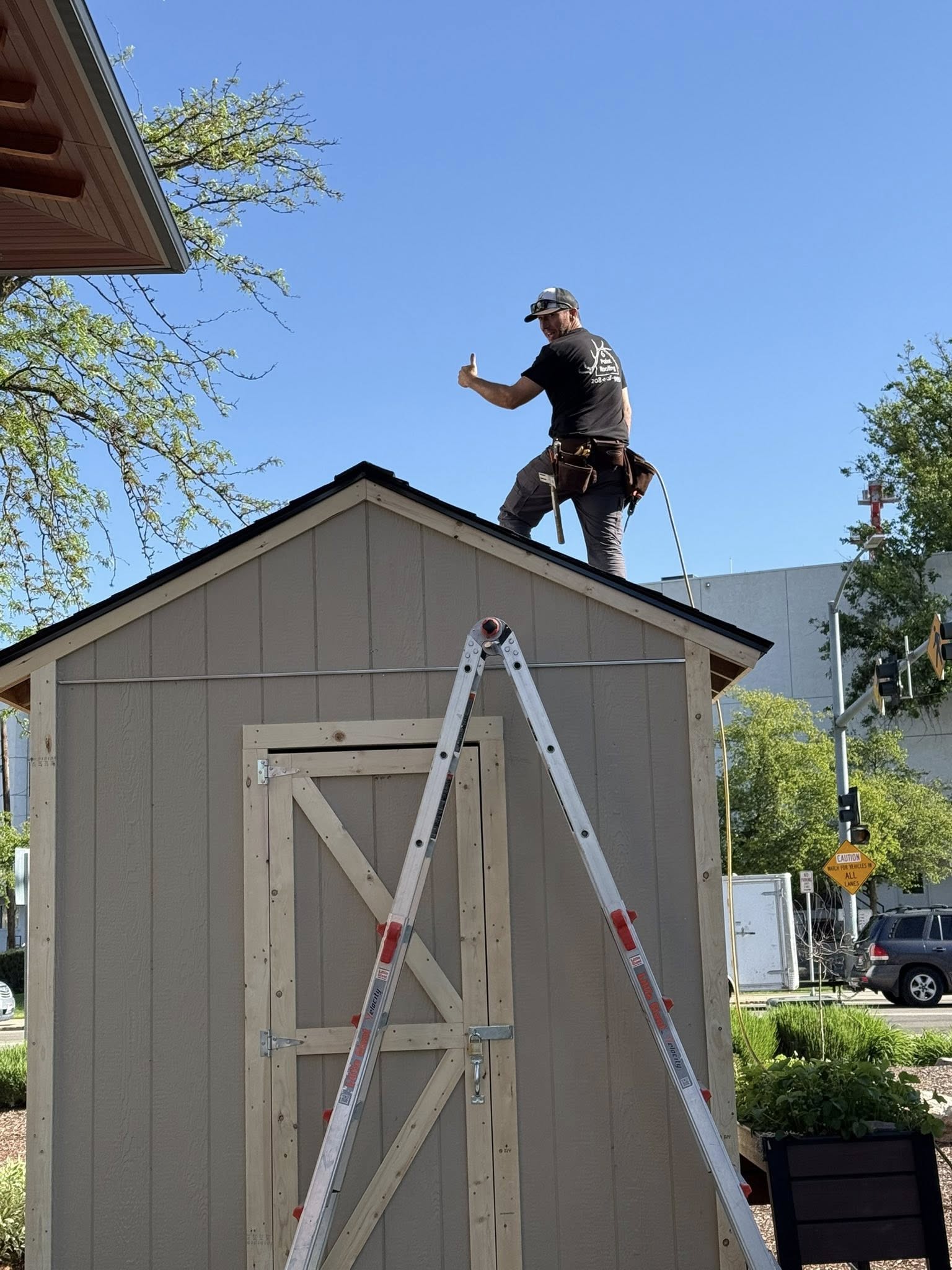 worker on a barn roof