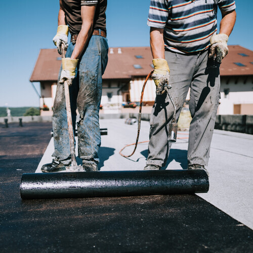 work being done on a commercial roof